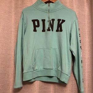 A blue VS quarter zip